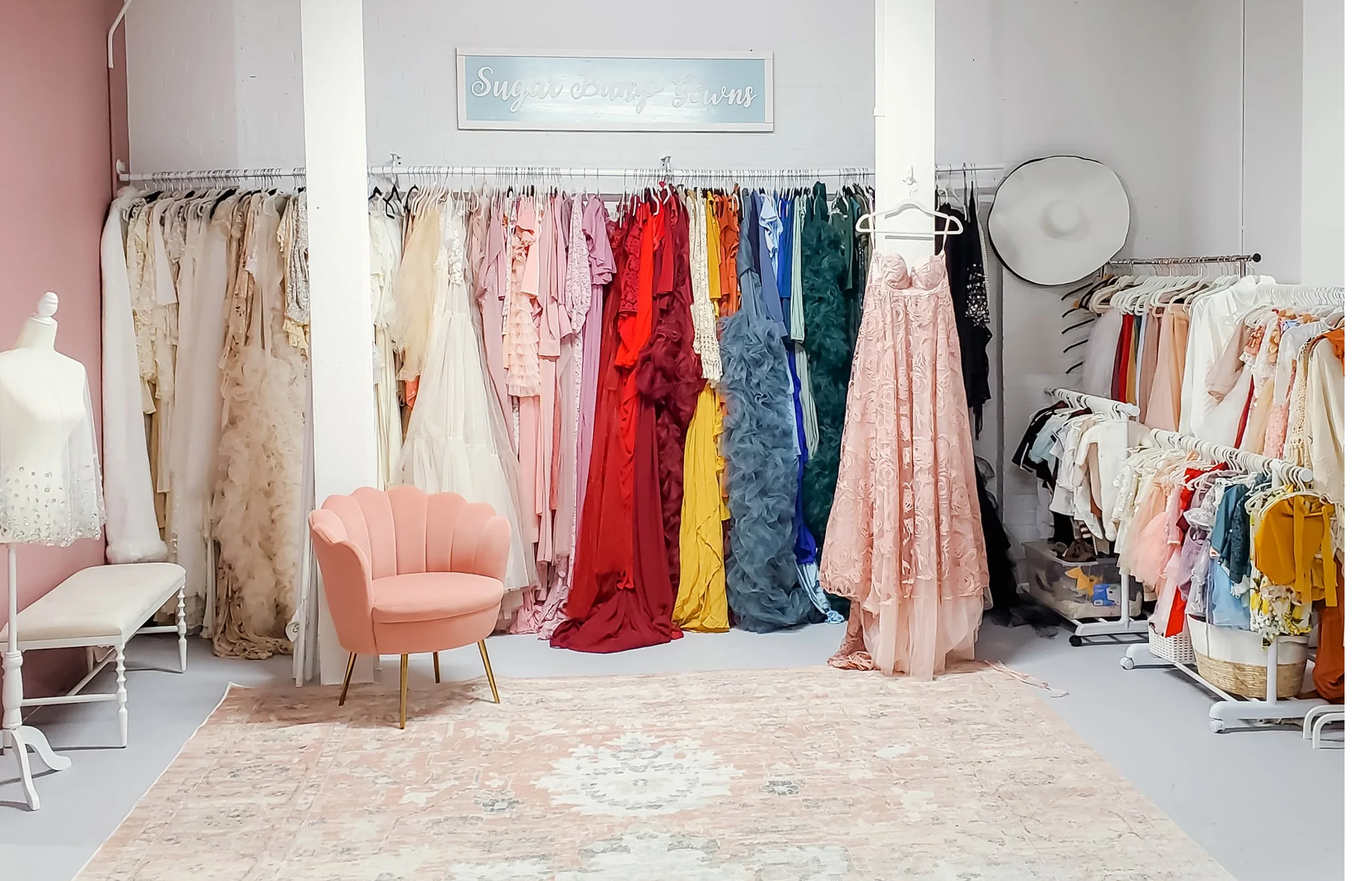 large collection of maternity photoshoot dresses in Stephanie Hope's photography studio